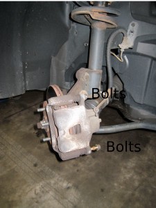 Two bolts Remove the two bolts to expose brake pads