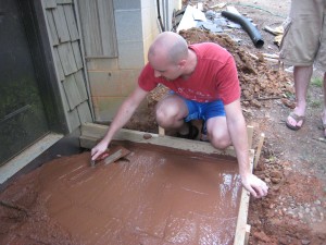 smoothing new concrete porch