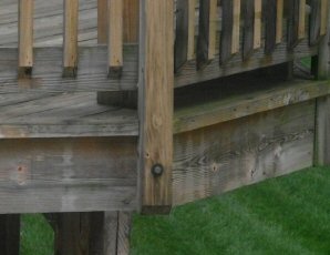 deck railing post on outside of rim joist