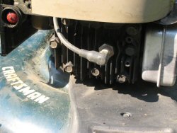 spark plug with spark plug wire on a craftsman lawnmower