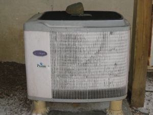 iced over heat pump compressor unit