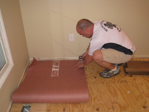 lay-red-rosin-paper-before-hardwood-installation