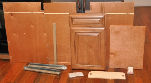 solid wood ipc cabinet components laid out on a kitchen floor