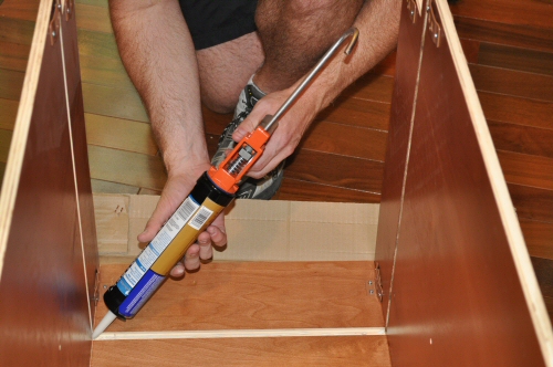 use construction adhesive on the cabinets